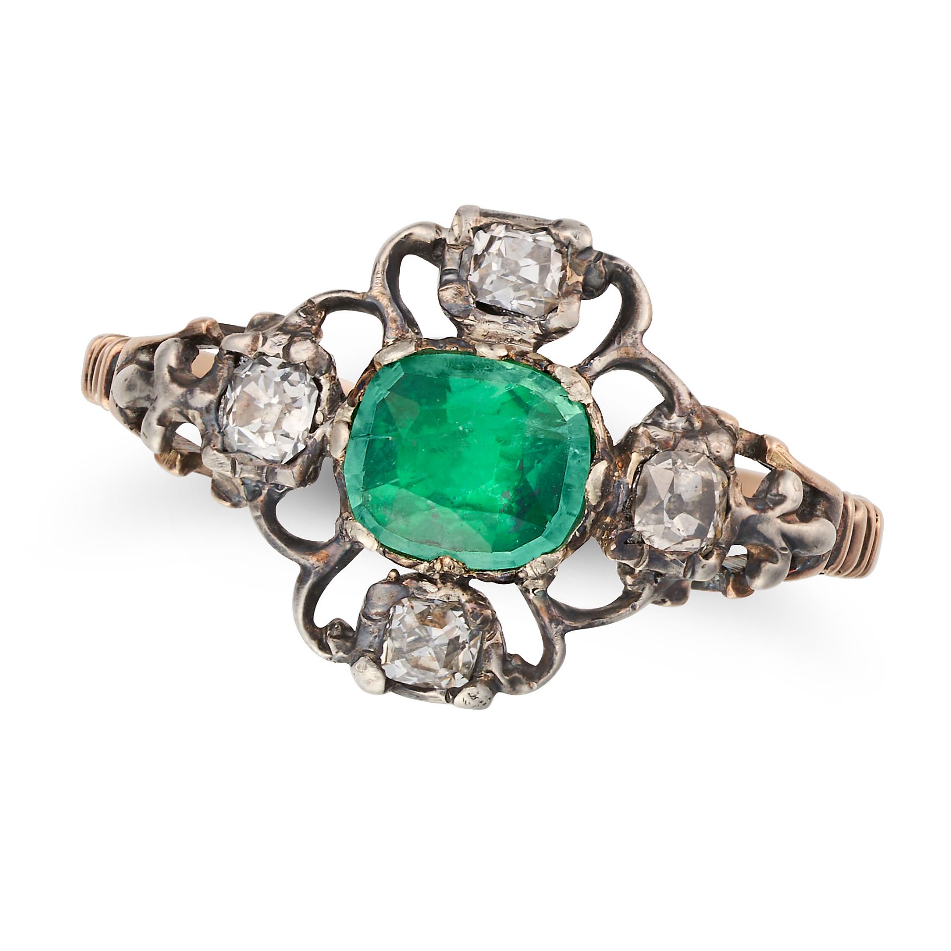 AN ANTIQUE EMERALD AND DIAMOND RING in yellow gold and silver, set with a cushion cut emerald acc...