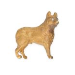 A DIAMOND DOG BROOCH in yellow gold, designed as a textured dog, the eyes set with rose cut diamo...