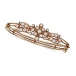 AN ANTIQUE PEARL BANGLE in yellow gold, the hinged bangle in foliate design, set with pearls, no ...