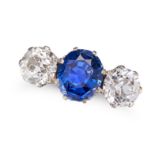 A CEYLON SAPPHIRE AND DIAMOND THREE STONE RING set with a round cut sapphire of 3.20 carats accen...
