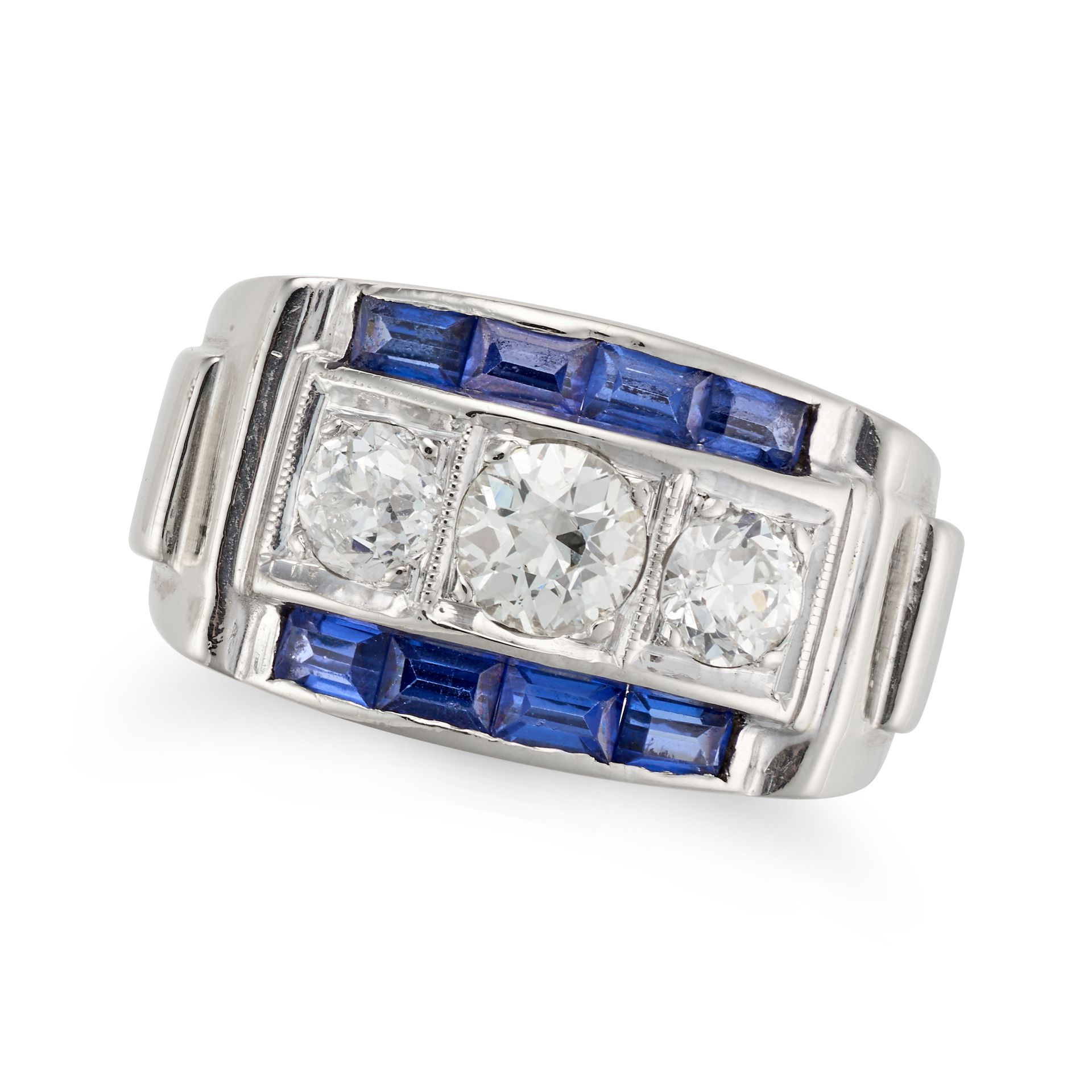 A DIAMOND AND SAPPHIRE RING, CIRCA 1940 set with three old European cut diamonds, accented on eac...