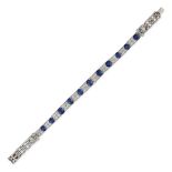 A SAPPHIRE AND DIAMOND BRACELET comprising a row of alternating cushion cut sapphires and cluster...