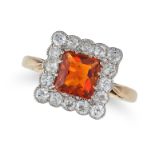 A CITRINE AND DIAMOND RING set with a rectangular step cut citrine in a border of old cut diamond...