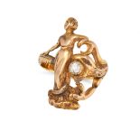 AN ART NOUVEAU DIAMOND SNAKE RING designed as a snake coiled around the figure of a woman, the sn...