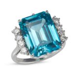 A BLUE ZIRCON AND DIAMOND RING set with an octagonal step cut blue zircon of approximately 18.18 ...