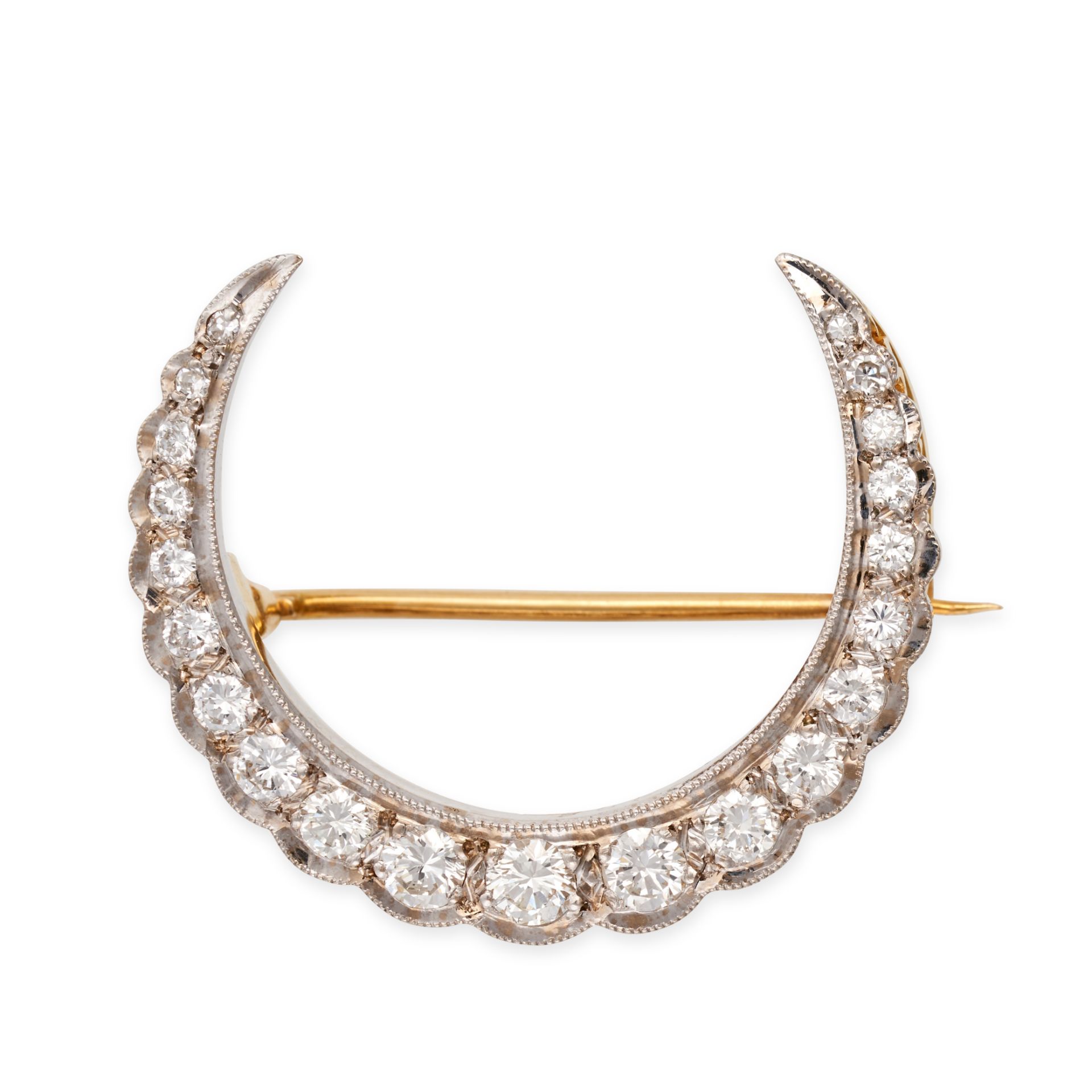 A DIAMOND CRESCENT MOON BROOCH in yellow gold, designed as a crescent moon set with a row of roun...