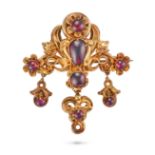 AN ANTIQUE GARNET BROOCH in yellow gold, the scrolling body set with oval and pear shaped cabocho...