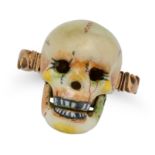 AN ENAMEL AND DIAMOND SKULL RING designed as a skull with an articulated jaw, decorated throughou...