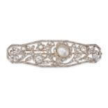 A NATURAL SALTWATER PEARL AND DIAMOND BROOCH in yellow and white gold, the openwork brooch in fol...