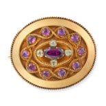 AN ANTIQUE GARNET AND CHRYSOLITE BROOCH in yellow gold, set with an oval cut garnet accented by r...