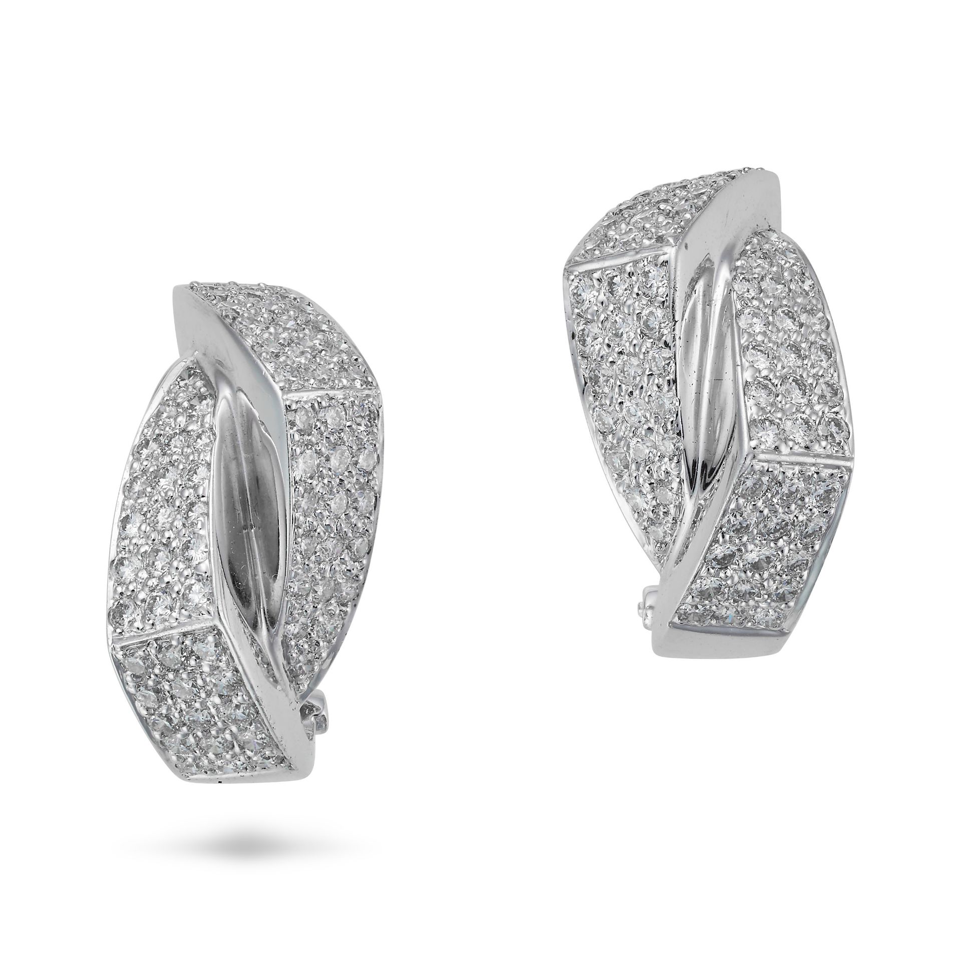 A PAIR OF DIAMOND HOOP EARRINGS each designed as a stylised hoop pave set with round brilliant cu...