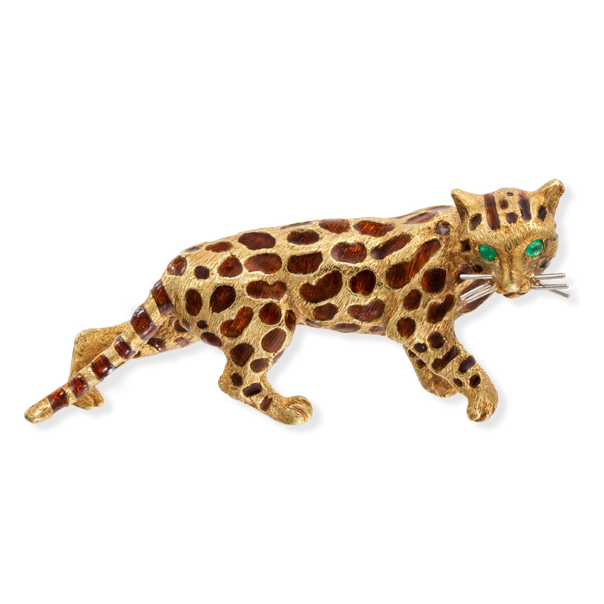 TIFFANY & CO., AN EMERALD AND ENAMEL CHEETAH BROOCH designed as a cheetah, the spots relieved in ...