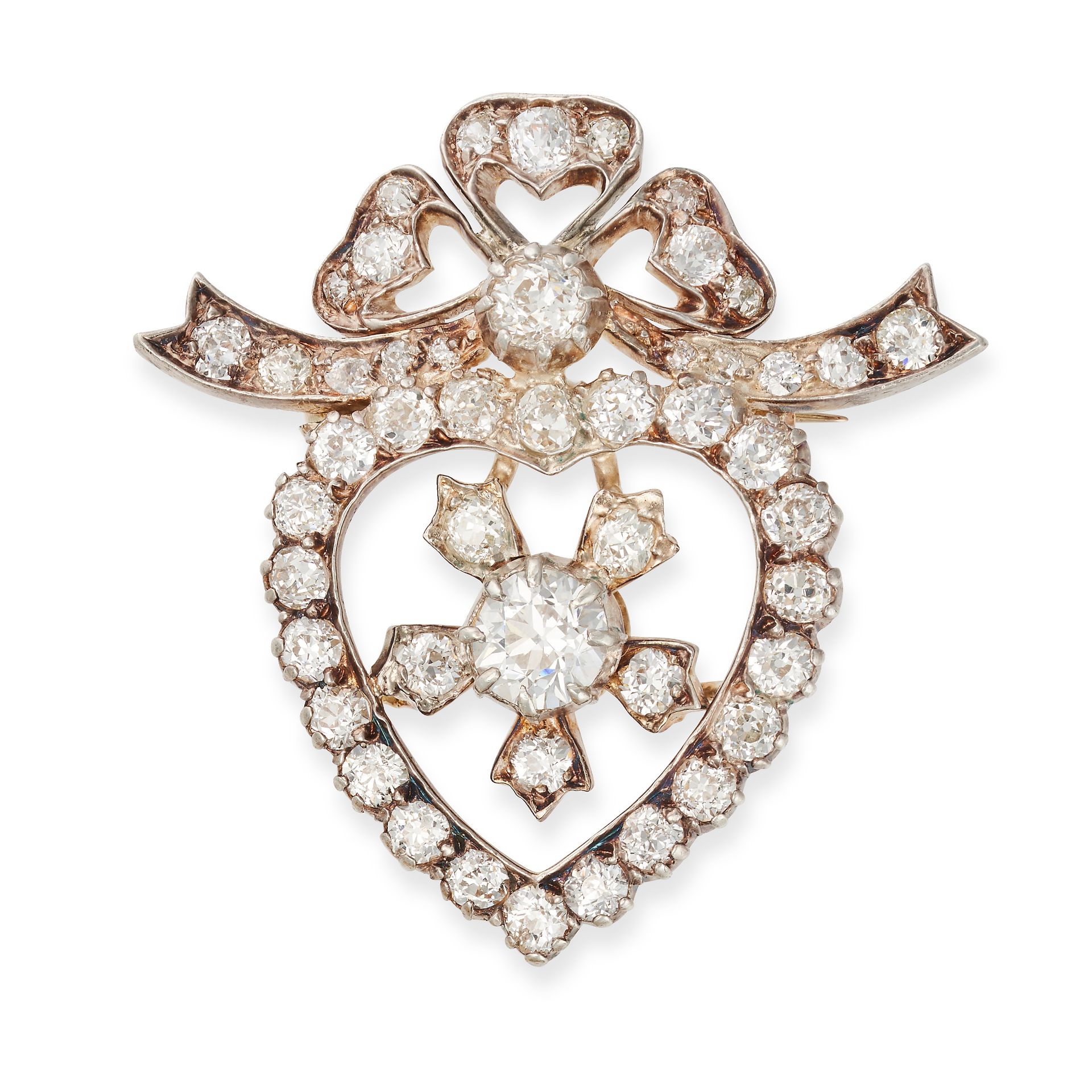 AN ANTIQUE DIAMOND BROOCH in yellow gold and silver, designed as an open heart set to the centre ...