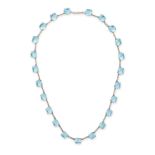 A BLUE ZIRCON NECKLACE comprising a row of round cut blue zircon, no assay marks, 40.5cm, 14.2g.