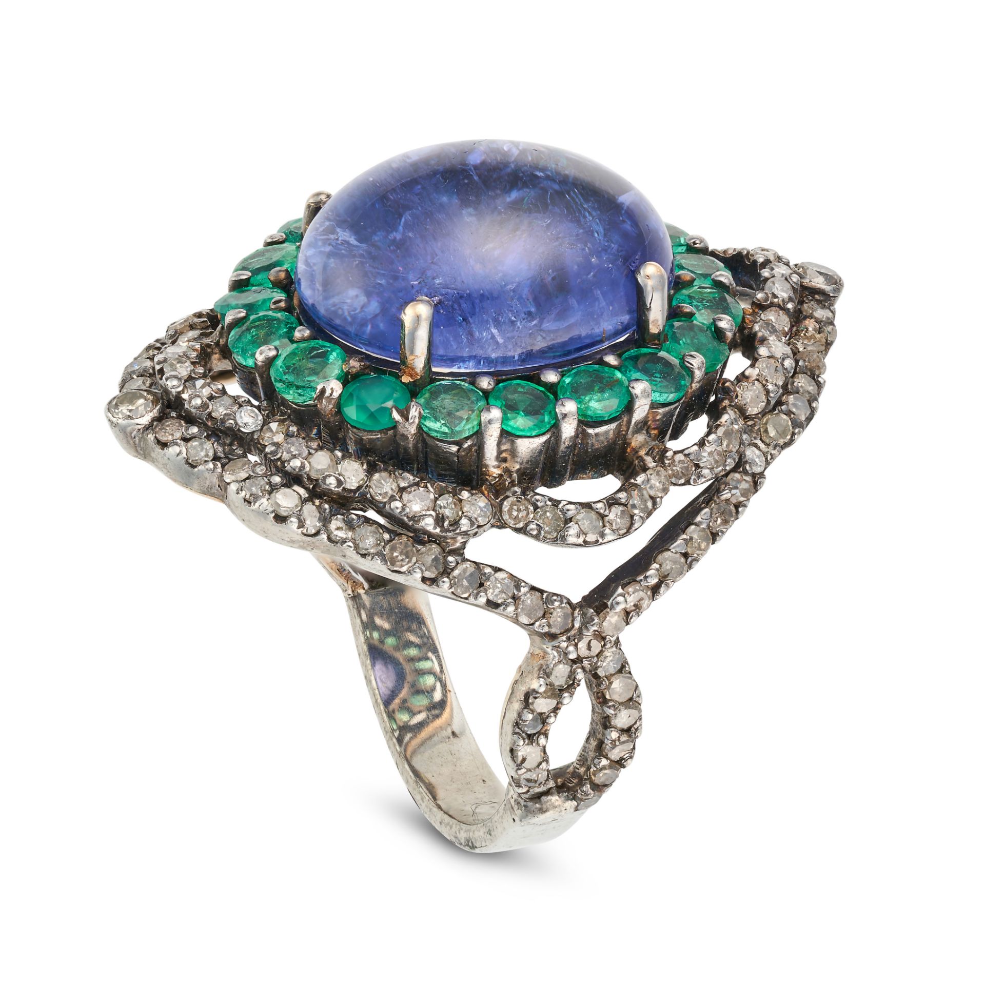 A TANZANITE, EMERALD AND DIAMOND COCKTAIL RING set with an oval cabochon tanzanite in a border of... - Image 2 of 2