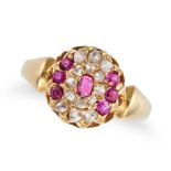 AN ANTIQUE RUBY AND DIAMOND CLUSTER RING in yellow gold, set with a cushion cut ruby in a cluster...