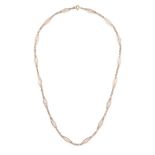 A CHAIN NECKLACE comprising a row of curb and fancy links, clasp stamped 750, 52.0cm, 7.0g.