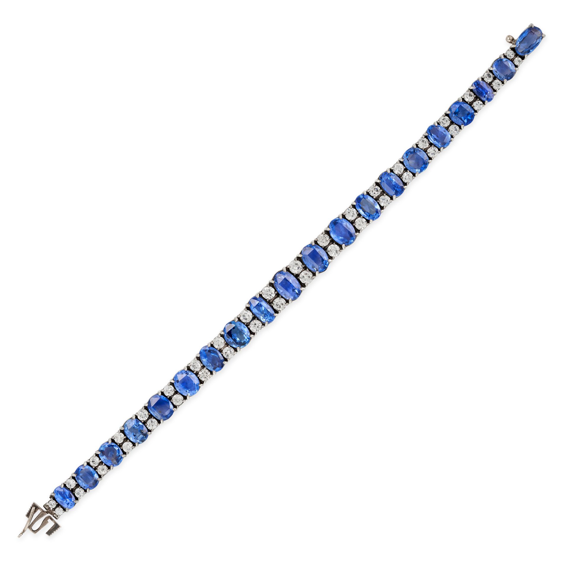 AN ANTIQUE BLUE AND WHITE SAPPHIRE BRACELET in silver, comprising a row of oval and cushion cut s...