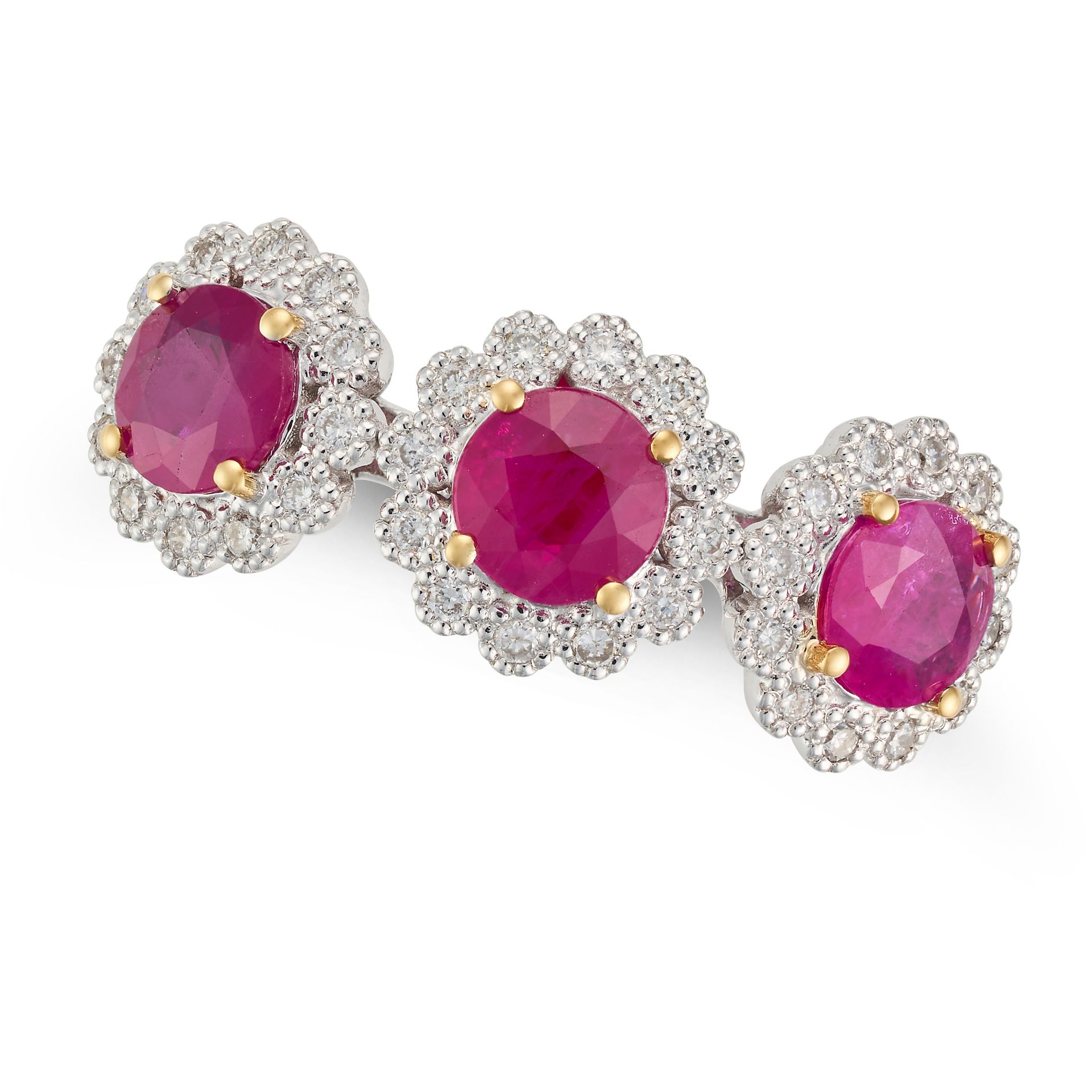 A RUBY AND DIAMOND TRIPLE CLUSTER RING set with three round cut rubies in clusters of round cut d...