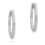 A PAIR OF DIAMOND HOOP EARRINGS each designed as a hoop set with a row of round brilliant cut dia...
