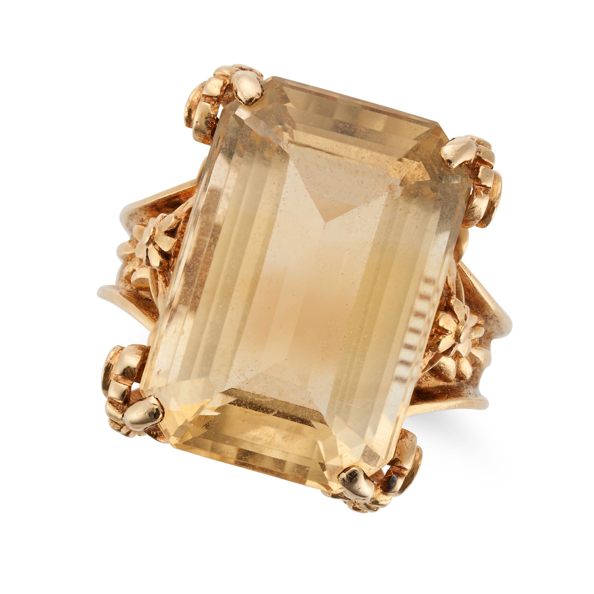 A VINTAGE CITRINE RING in yellow gold, set with an octagonal step cut citrine in an ornate settin...