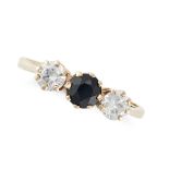 NO RESERVE - A SAPPHIRE AND WHITE GEMSTONE THREE STONE RING in 9ct yellow gold, set with a round ...