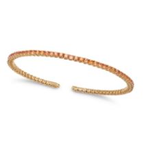 AN ORANGE SAPPHIRE BRACELET the open bangle set with a row of round cut orange sapphires, stamped...
