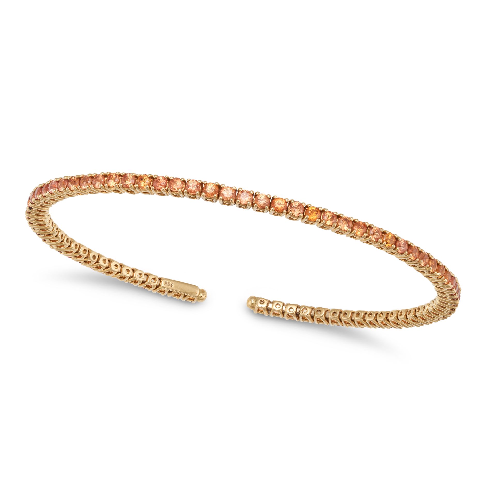 AN ORANGE SAPPHIRE BRACELET the open bangle set with a row of round cut orange sapphires, stamped...