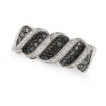 NO RESERVE - A BLACK AND WHITE DIAMOND DRESS RING pave set with round cut black diamonds accented...