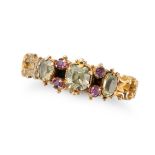 AN ANTIQUE CHRYSOLITE AND RUBY RING in yellow gold, set with three cushion cut chrysolites, accen...