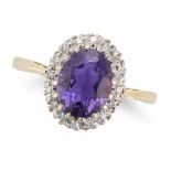 AN AMETHYST AND DIAMOND CLUSTER RING in 18ct yellow gold, set with an oval cut amethyst in a clus...