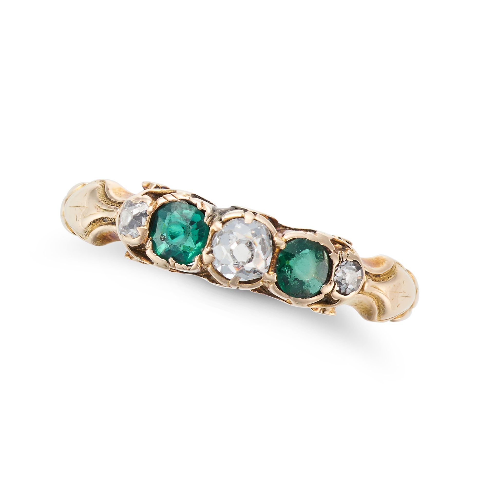 AN ANTIQUE DIAMOND AND GREEN PASTE RING in yellow gold, set with three old cut diamonds and two r...