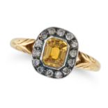 A YELLOW SAPPHIRE AND DIAMOND RING set with an octagonal step cut yellow sapphire in a border of ...