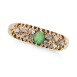 AN ANTIQUE EMERALD AND DIAMOND RING in 18ct yellow gold, set with an oval cut emerald accented by...