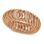 A DIAMOND BRACELET the elasticated gas pipe bracelet, accented by pave set round brilliant cut di...