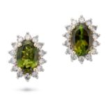 A PAIR OF GREEN TOURMALINE AND DIAMOND CLUSTER STUD EARRINGS each set with an oval cut green tour...