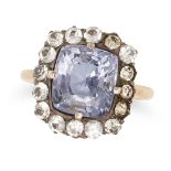 A SPINEL AND PASTE CLUSTER RING set with a cushion cut spinel of approximately 4.10 carats in a c...