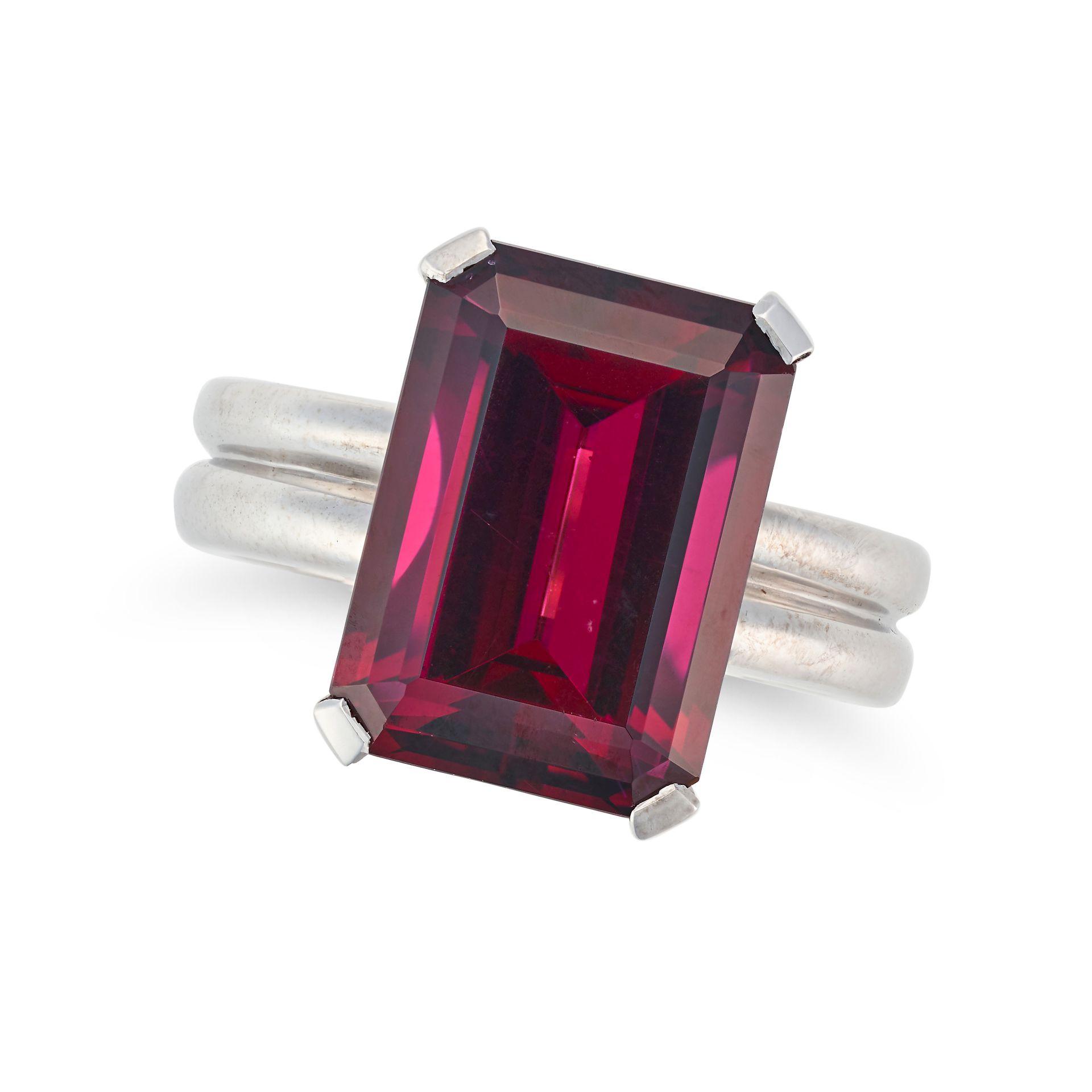 A RHODOLITE GARNET RING set with an octagonal step cut rhodolite garnet of 10.34 carats, no assay...