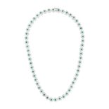 AN EMERALD AND DIAMOND NECKLACE comprising a row of round cut emeralds in borders of round brilli...