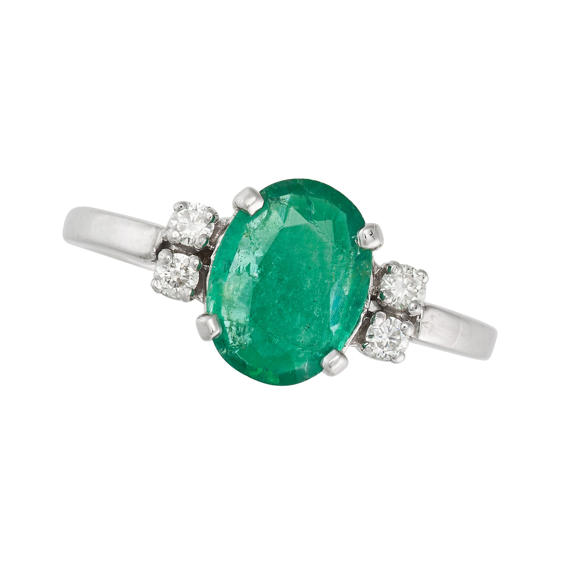 AN EMERALD AND DIAMOND RING set with an oval cut emerald of approximately 1.45 carats, accented o...