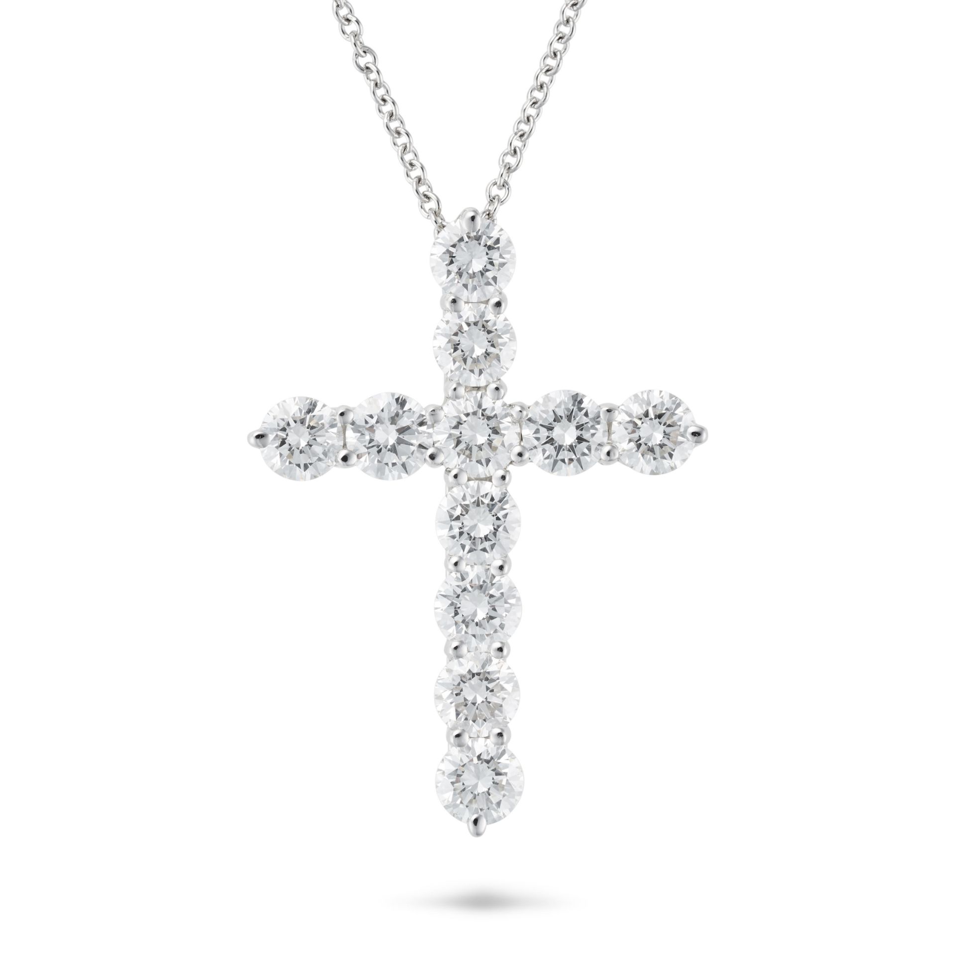 TIFFANY & CO., A DIAMOND CROSS PENDANT NECKLACE in platinum, the pendant designed as a cross set ...