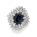 A SAPPHIRE AND DIAMOND BALLERINA RING set with an oval cut sapphire of approximately 2.40 carats ...