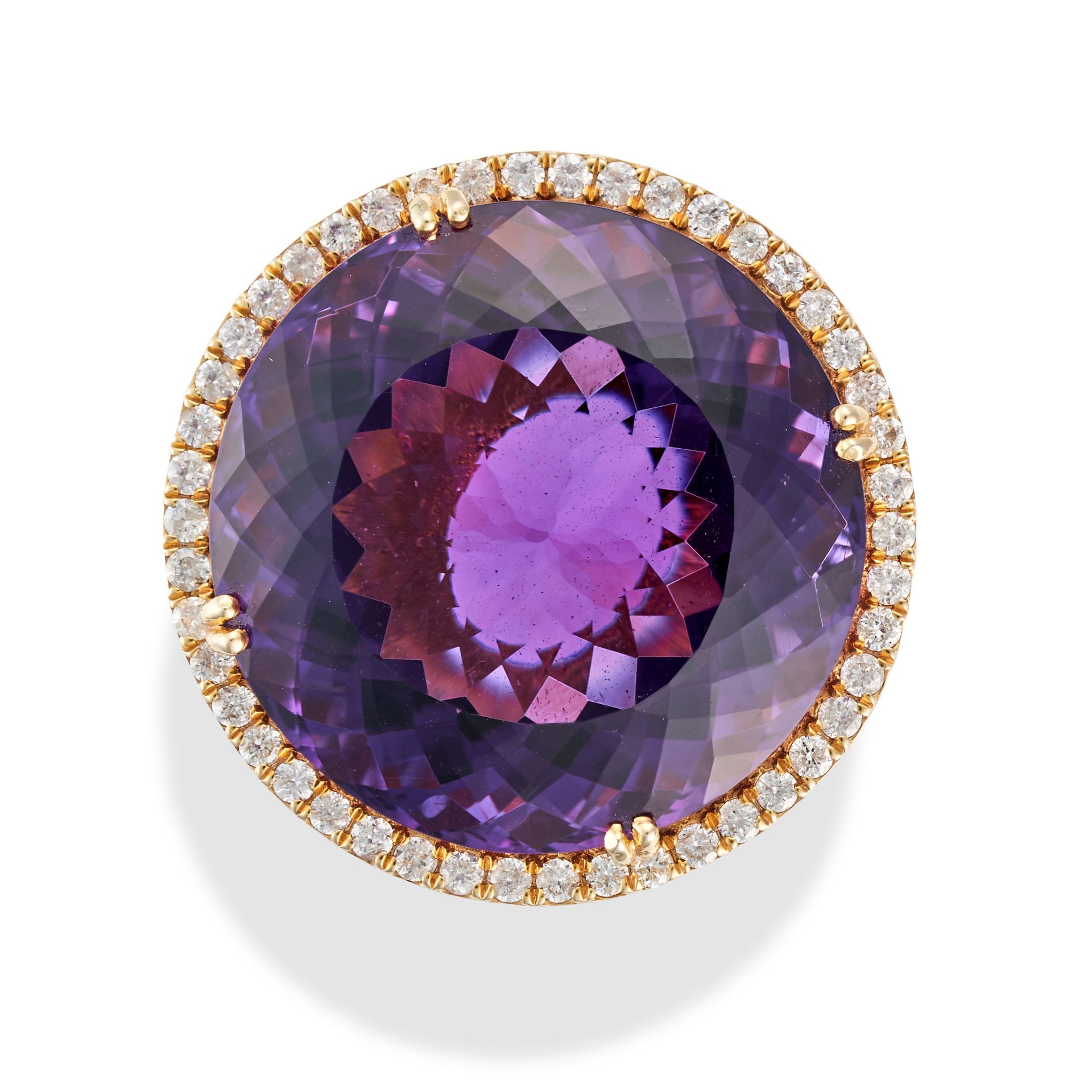 AN AMETHYST AND DIAMOND DRESS RING set with a round cut amethyst of 31.34 carats in a border of r...