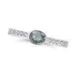 A GREEN SAPPHIRE AND DIAMOND RING set with an oval cut green sapphire accented by round cut diamo...