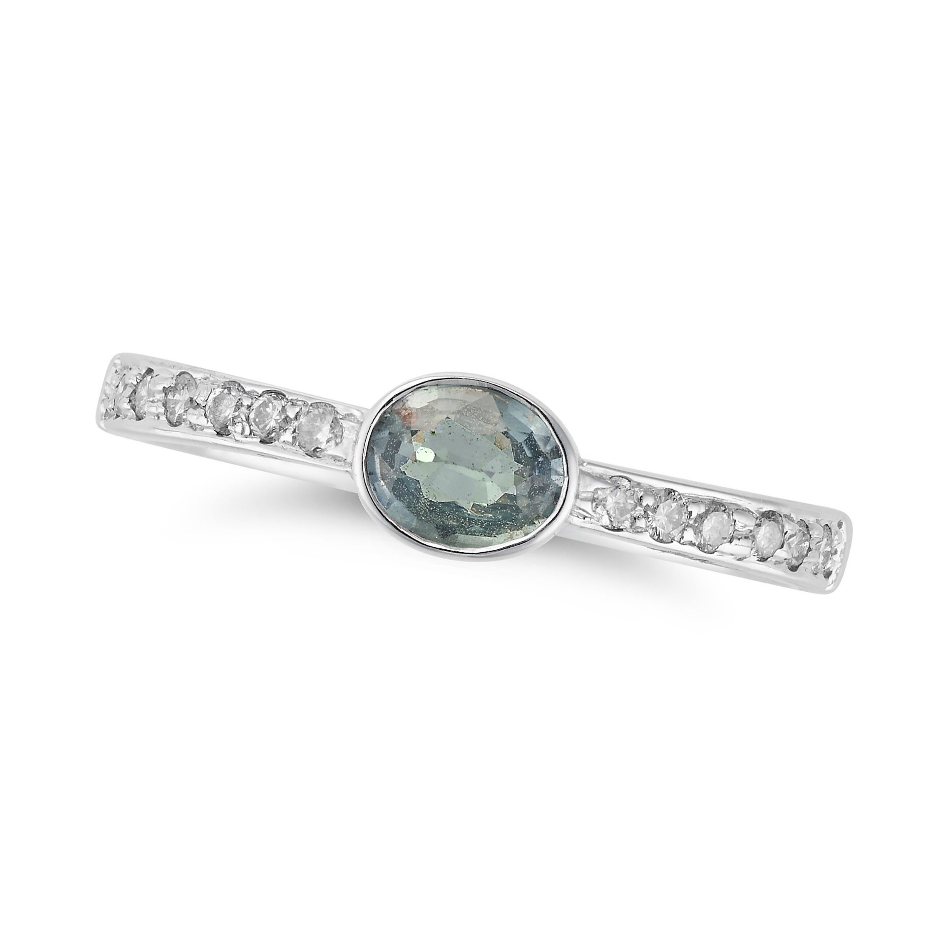 A GREEN SAPPHIRE AND DIAMOND RING set with an oval cut green sapphire accented by round cut diamo...