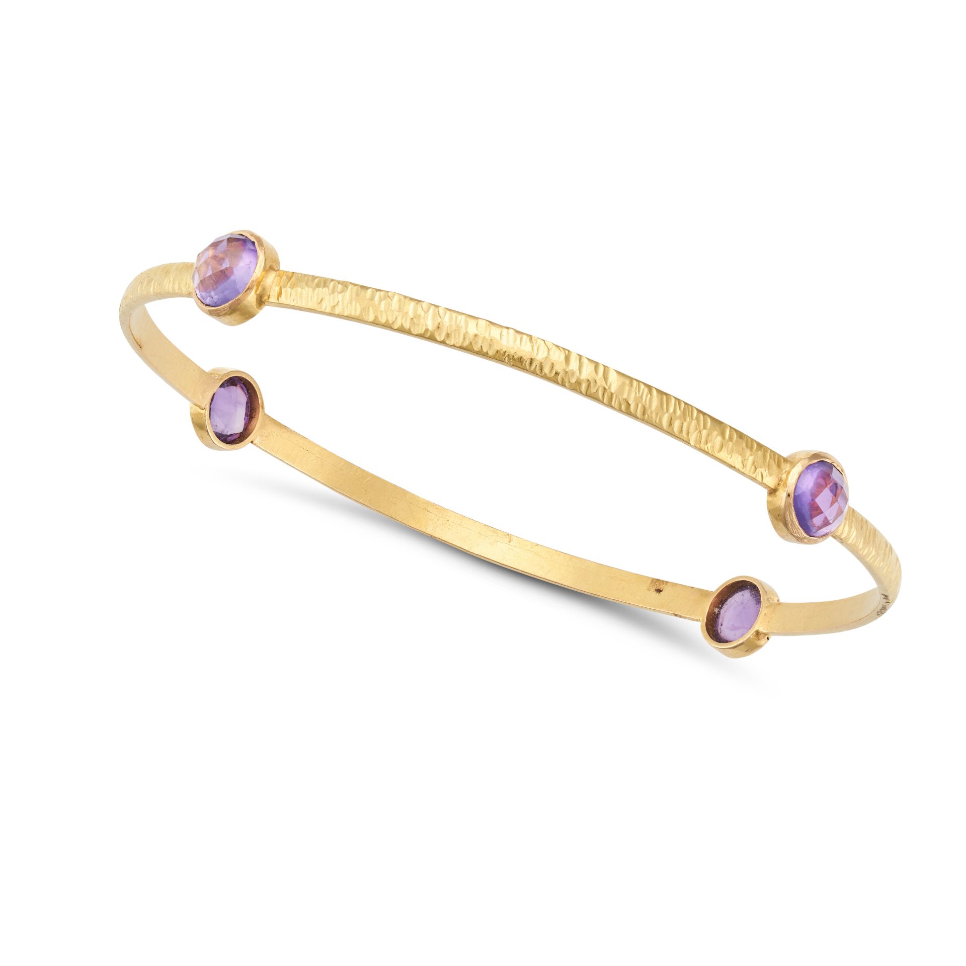 AN AMETHYST BANGLE the closed bangle set with four fancy cut amethysts, stamped 18K, inner circum...