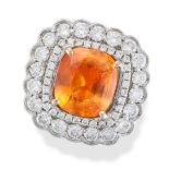 AN ORANGE SAPPHIRE AND DIAMOND CLUSTER RING in 18ct white gold, set with a cushion cut orange sap...