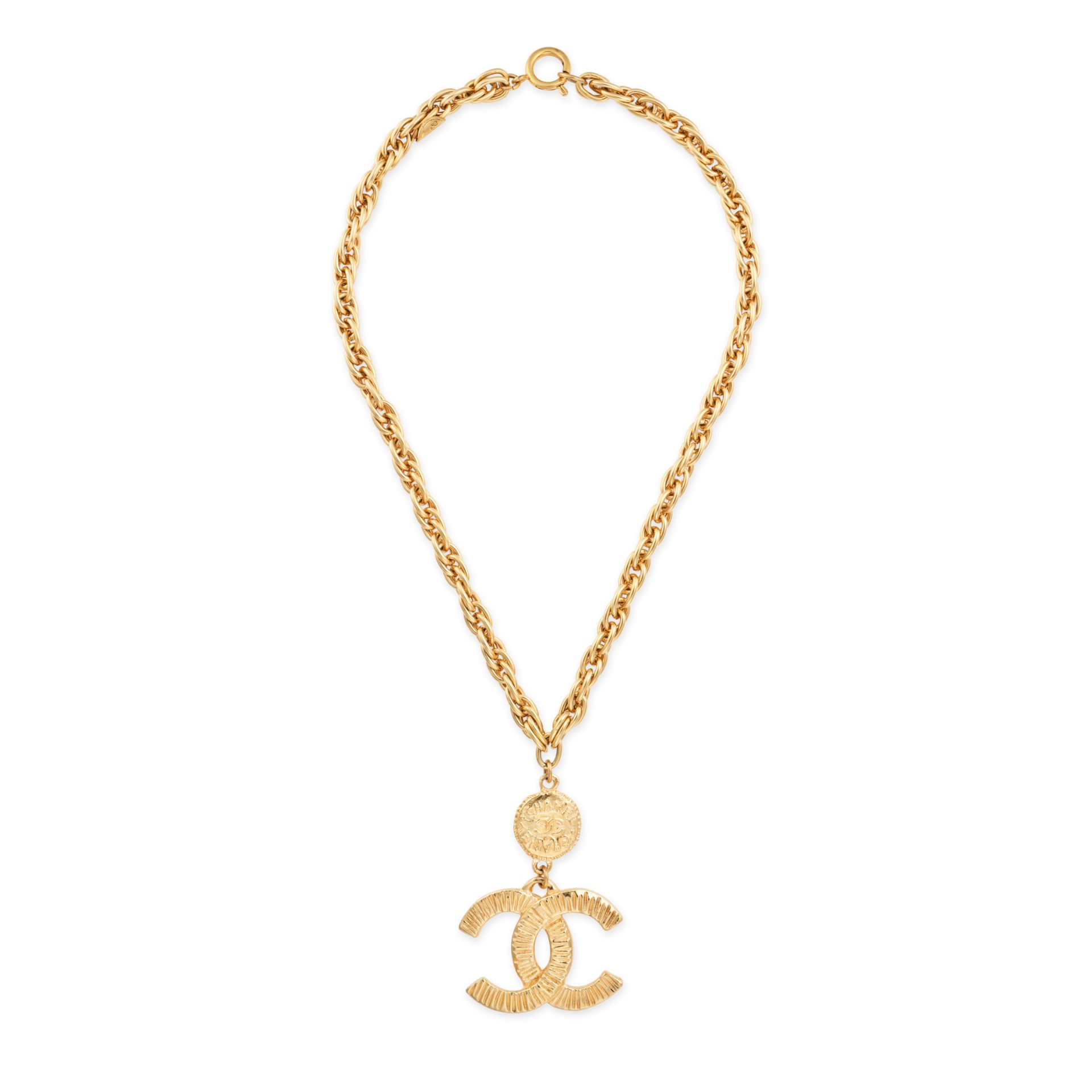 NO RESERVE - CHANEL, A VINTAGE CC NECKLACE comprising a fancy link chain, suspending a textured C...