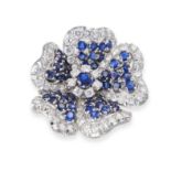 A SAPPHIRE AND DIAMOND FLOWER BROOCH set to the centre with a round cut sapphire in a cluster of ...