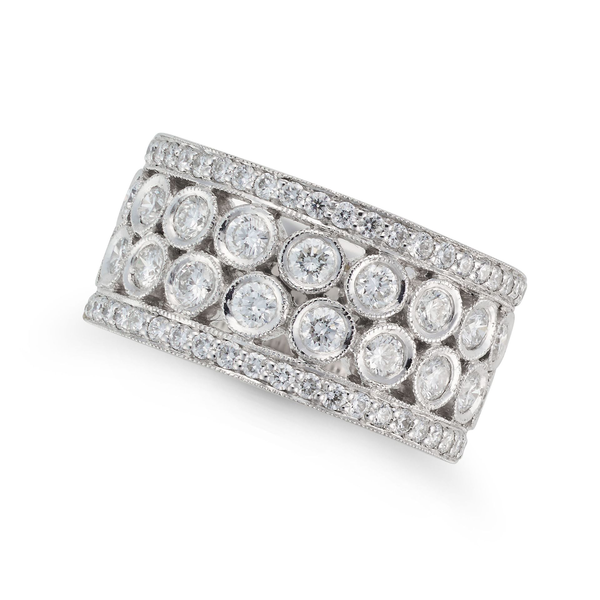 A DIAMOND RING in platinum, the openwork ring set with two rows of round brilliant cut diamonds, ...